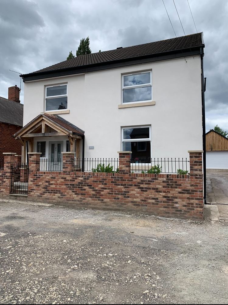 Full-house exterior white monocouche render on a detached property in Yorkshire
