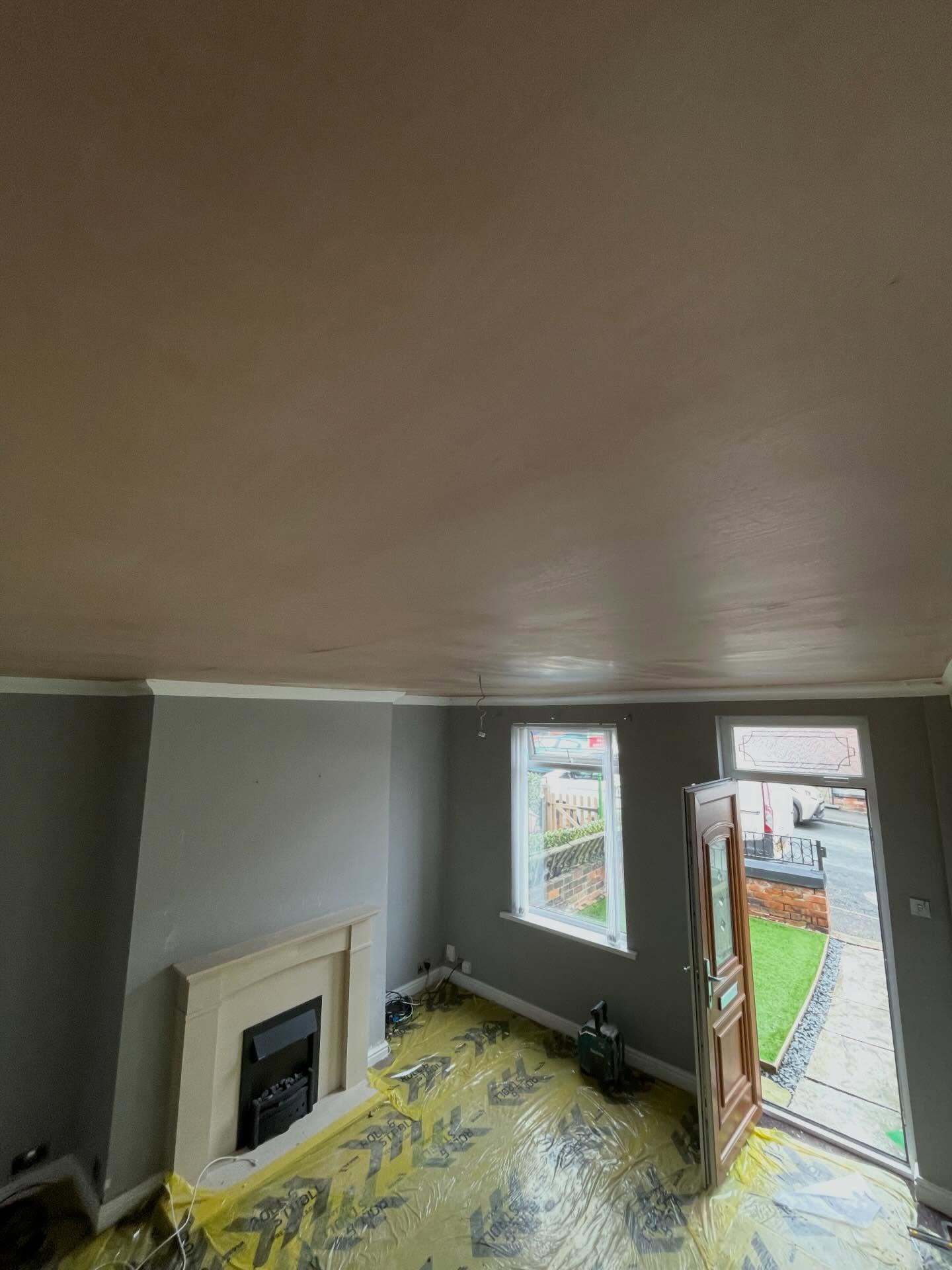 Freshly overboarded and skimmed living room ceiling drying out
