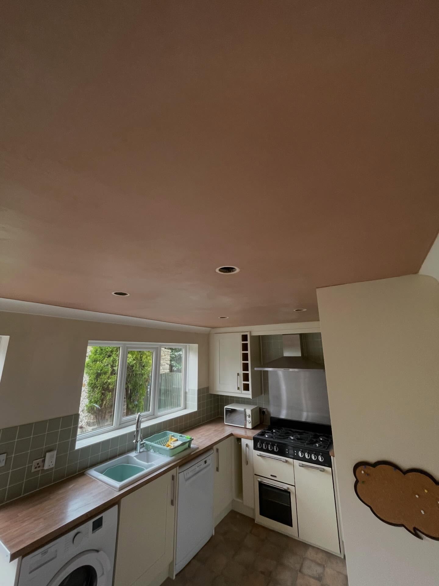 Smooth fresh-skim kitchen ceiling covering old artex, ready for paint